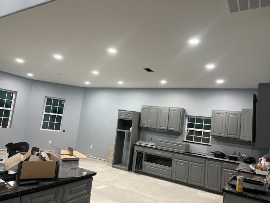Full kitchen remodel with gray cabinetry and recessed lighting