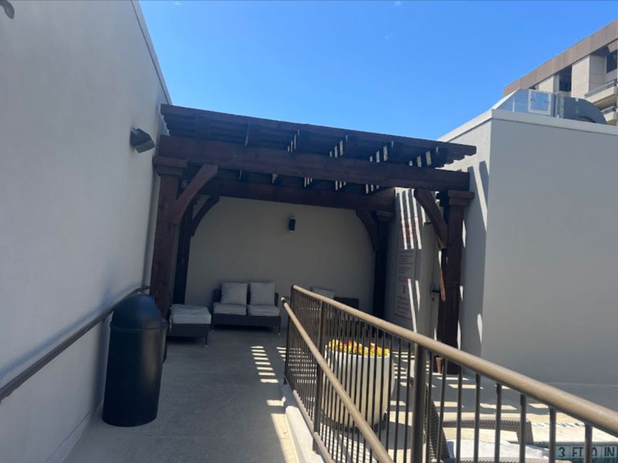 Outdoor patio with heavy timber pergola and lounge area